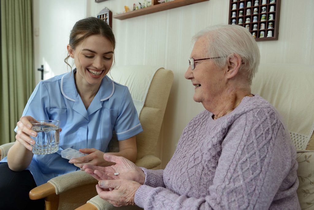 Emar 02 Carer giving medication to elderly lady